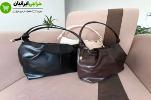 نمای نزدیک دسته گره‌ای و زیپ بالایی کیف مجلسی زنانه