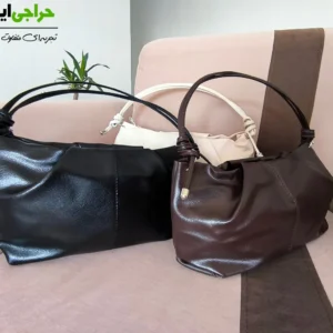 نمای نزدیک دسته گره‌ای و زیپ بالایی کیف مجلسی زنانه